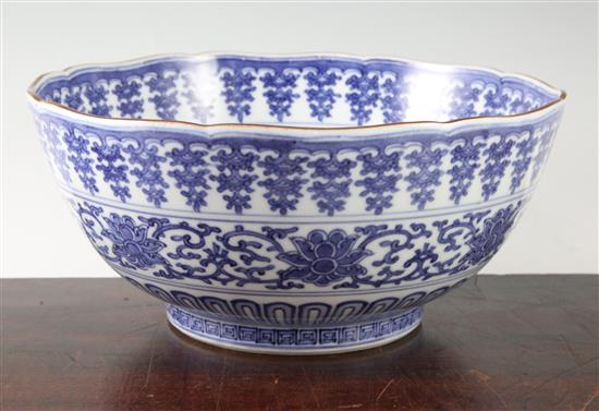 An unusual large Japanese Arita blue and white Kakiemon style bowl, Qianlong mark, 19th century, 30cm, hairline crack